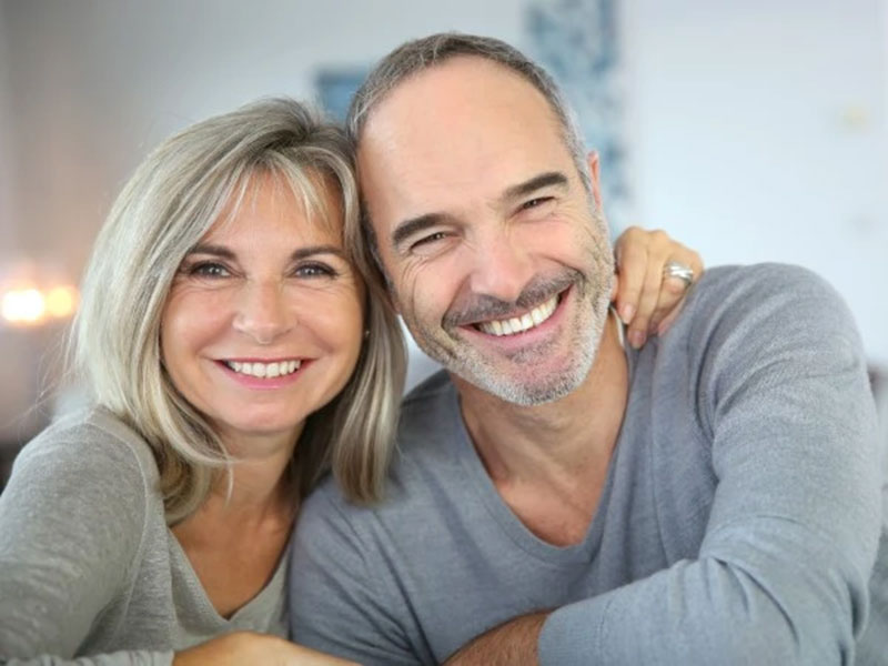 an old couple smiling