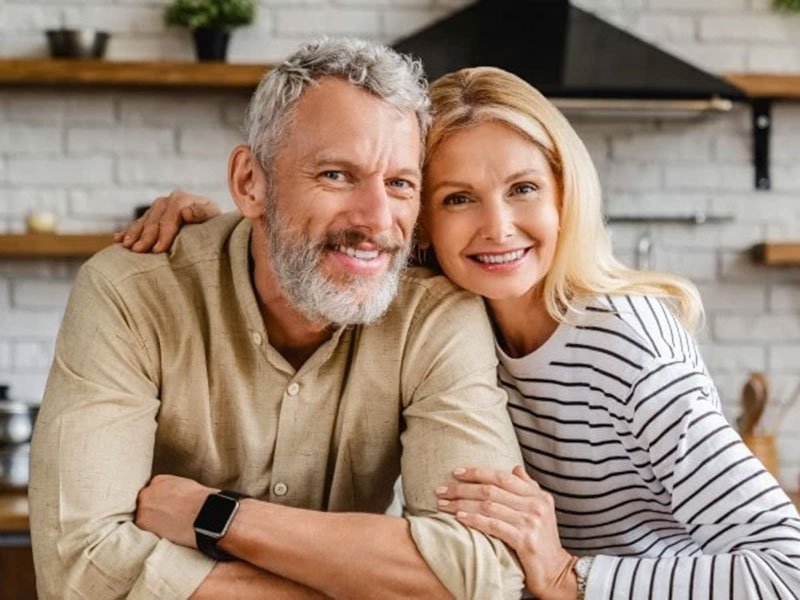 A Couples sitting together and smiling