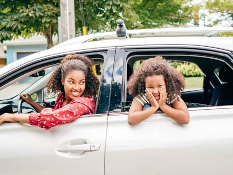 daughter with her mom in car