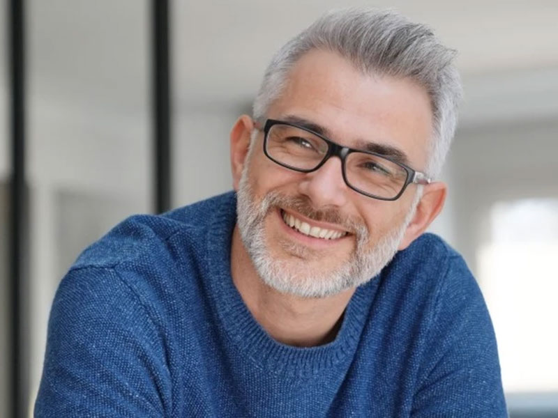 a man in blue t-shirt smiling